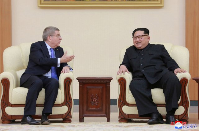International Olympic Committee (IOC) President Thomas Bach meets with North Korean leader Kim Jong Un, in this undated photo released by North Korea's Korean Central News Agency (KCNA) in Pyongyang March 31, 2018. KCNA/via Reuters ATTENTION EDITORS - THIS IMAGE WAS PROVIDED BY A THIRD PARTY. REUTERS IS UNABLE TO INDEPENDENTLY VERIFY THIS IMAGE. NO THIRD PARTY SALES. NOT FOR USE BY REUTERS THIRD PARTY DISTRIBUTORS. SOUTH KOREA OUT.     TPX IMAGES OF THE DAY