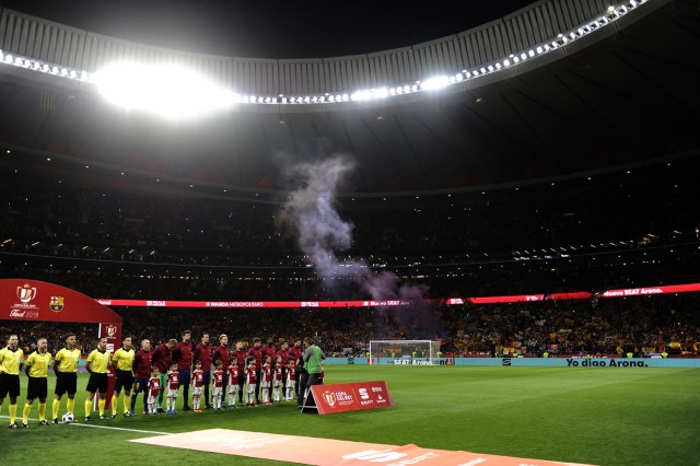 Barcelona's players listen to the Spanish anthem before the Spanish Copa del Rey (King's Cup) final football match Sevilla FC against FC Barcelona at the Wanda Metropolitano stadium in Madrid on April 21, 2018.  / AFP PHOTO / CRISTINA QUICLER