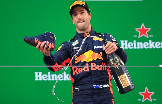 Formula One F1 - Chinese Grand Prix - Shanghai International Circuit, Shanghai, China - April 15, 2018 Red Bull's Daniel Ricciardo with champagne and a shoe as he celebrates winning the race REUTERS/Aly Song