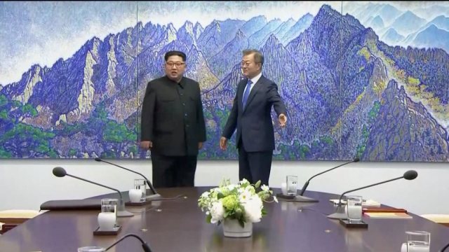 South Korean President Moon Jae-in and North Korean leader Kim Jong Un arrive for talks at the inter-Korean summit at the truce village of Panmunjom, in this still frame taken from video, South Korea April 27, 2018. Host Broadcaster via REUTERS TV  ATTENTION EDITORS - THIS IMAGE HAS BEEN PROVIDED BY A THIRD PARTY. NO RESALES. NO ARCHIVES. SOUTH KOREA OUT.