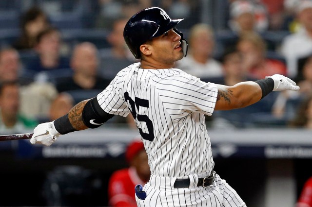 May 25, 2018; Bronx, NY, USA; New York Yankees second baseman Gleyber Torres (25) hits a solo home run against the Los Angeles Angels during the seventh inning at Yankee Stadium. Mandatory Credit: Adam Hunger-USA TODAY Sports
