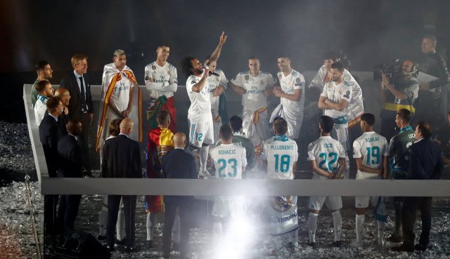 Soccer Football - Real Madrid celebrate winning the Champions League Final - Santiago Bernabeu, Madrid, Spain - May 27, 2018   Real Madrid's Marcelo with team mates during the victory celebrations   REUTERS/Javier Barbancho