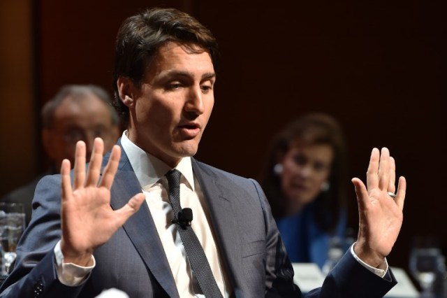 (FILES) In this file photo taken on May 17, 2018 Canadian Prime Minister Justin Trudeau speaks during a lunch at the Economic Club of New York, at the Ziegfeld Ballroom, in New York City. Canada hit back at steep US tariffs on aluminum and steel on May 31, 2018, announcing retaliatory duties on American goods worth up to Can$16.6 billion (USD$12.8 billion).At a news conference, Prime Minister Justin Trudeau said the US tariffs announced earlier were "totally unacceptable.""These tariffs are an affront to the long standing security partnership between Canada and the United States, and in particular, an affront to the thousands of Canadians who have fought and died alongside their American brothers in arms," he said, noting the US national security justification for its measures.  / AFP PHOTO / HECTOR RETAMAL