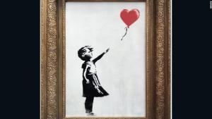 Una obra de Banksy se autodestruye tras ser subastada por un millón de libras (video)